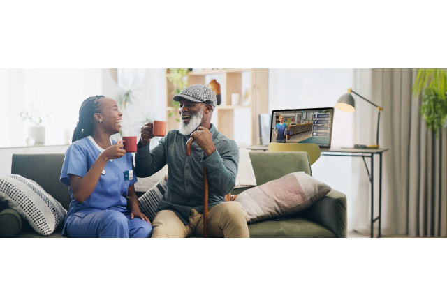 Senior and Caregiver with Addison Tablet in background