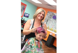 A young client getting his hair styles at Wild Styles