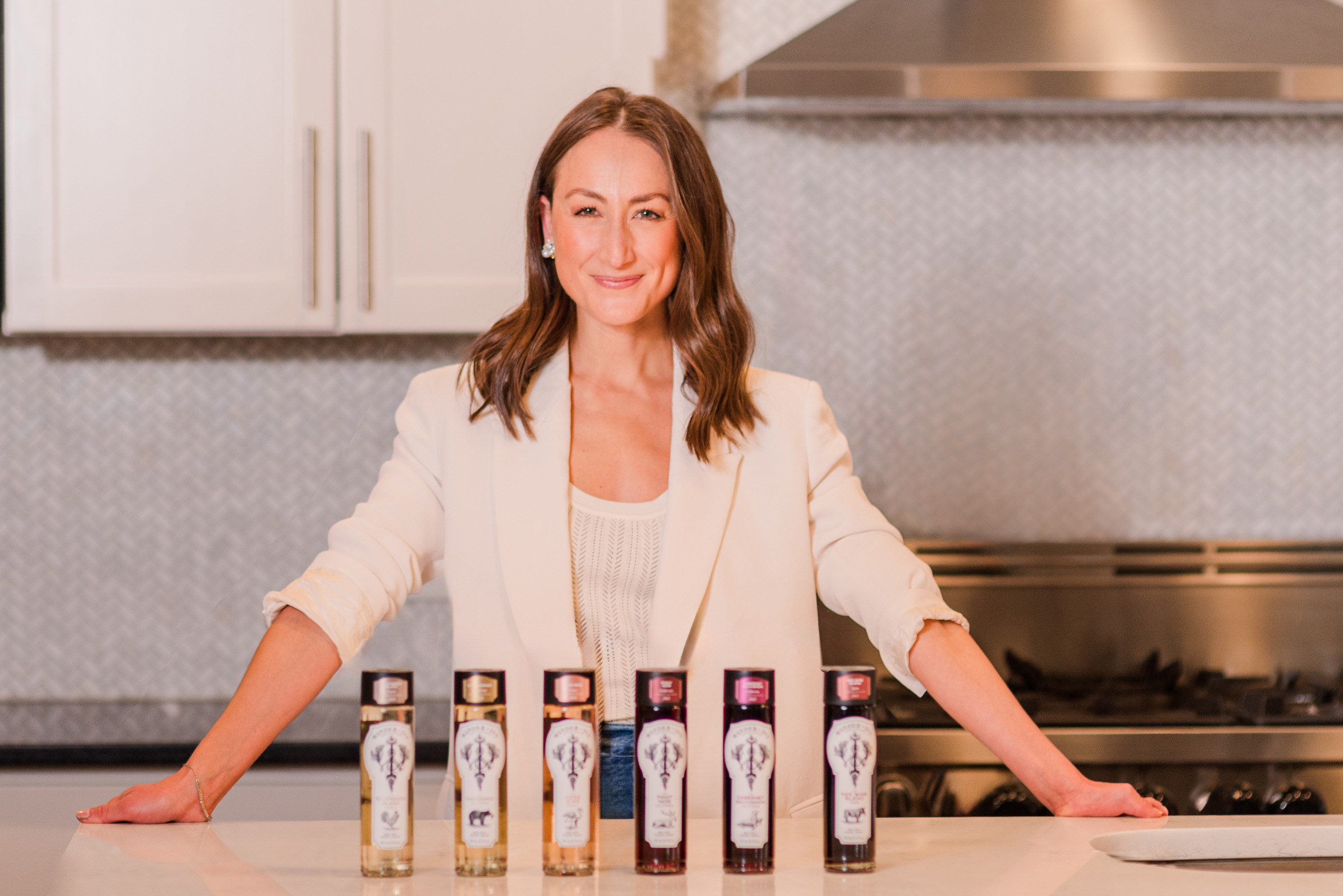 Wander + Ivy founder + CEO Dana Spaulding with her portfolio of single-serve wines