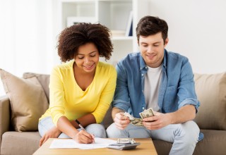 Happy Couple Doing Finances 