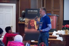 Rev. Brian Fesler, Pastor of the Church of Scientology Nashville, introduces youngsters to the Youth for Human Rights materials.