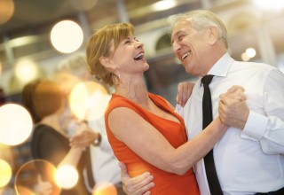 Older Couple Dancing and Smiling