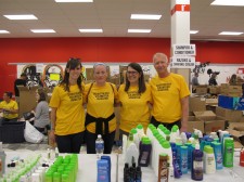 Kara Murray (second from left) and other Scientology Volunteer Ministers at a shelter in Edmonton where they are distributing donated supplies to evacuees.