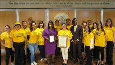 Florida State Senator Daphne Campbell and the Volunteer Ministers of the Church of Scientology Miami, where the senator (center) presented the VMs with a proclamation in recognition of their help.