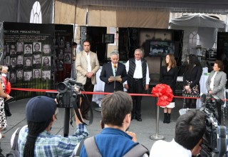 Cutting the ribbon to the exhibit