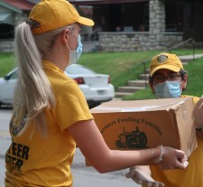 Volunteer Ministers brave triple-digit temperatures to bring fresh fruit and other staples to needy Kansas City families, participating in food drives organized by three local churches.