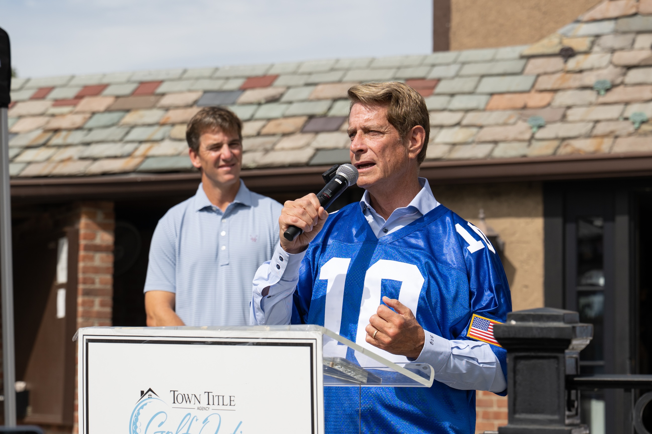 Robert C. Garrett with Eli Manning 
