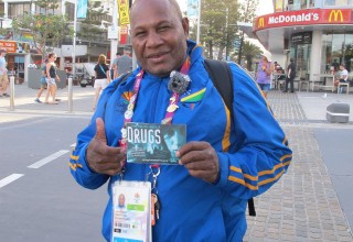 An athlete from the Solomon Islands with his copy of Truth About Drugs