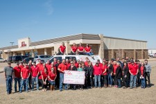 Homes by Taber employees present a check to Anna's House Foundation