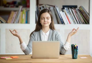 Woman Meditating in Home Office