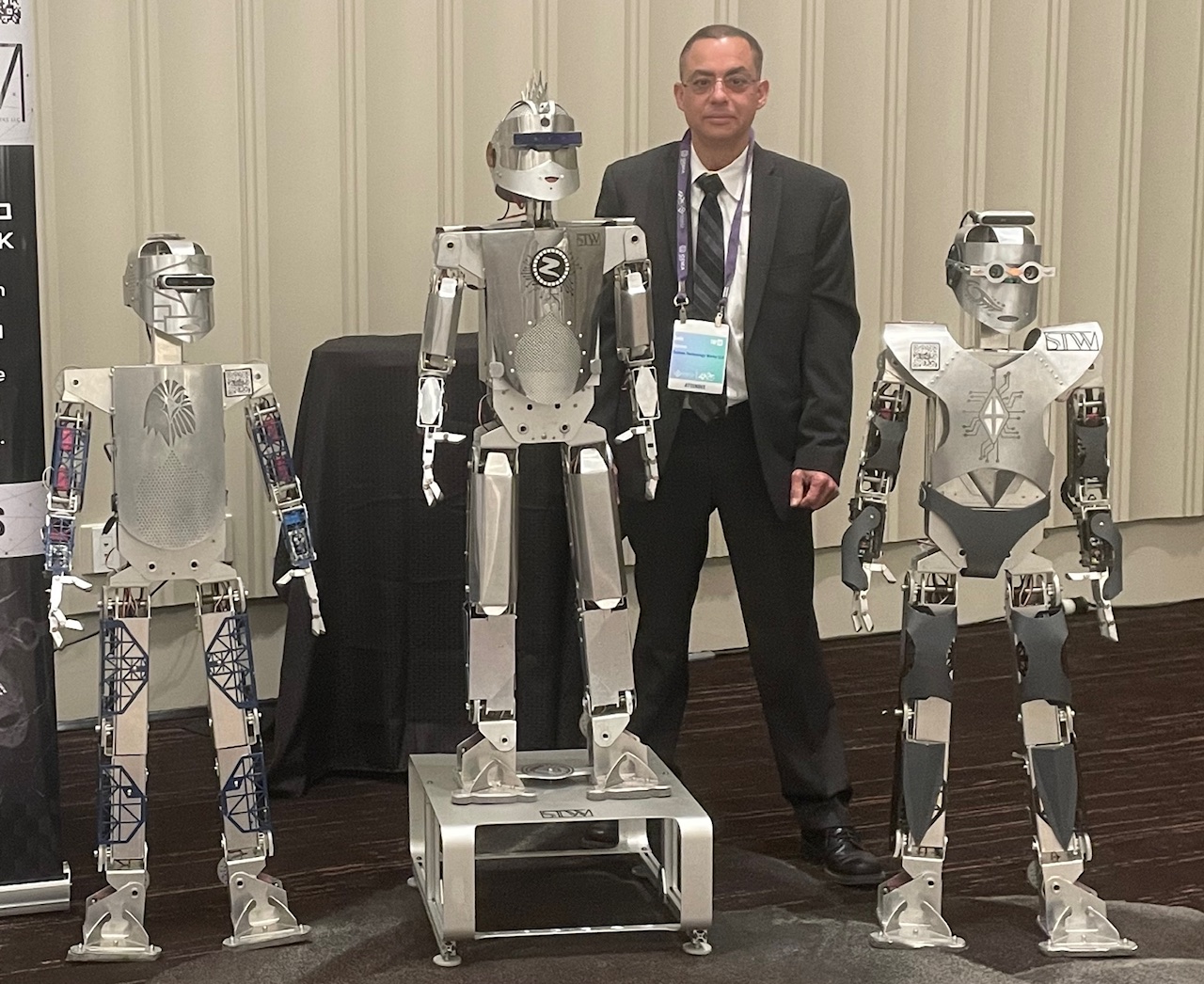 System Technology Works CEO Luis Guzman & Three Zeus2Q Robots 