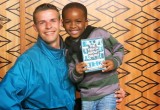 South African Men of the Year a runner-up Maurithus Meiring, with an enthusiastic young supporter at a drug education open house at the Church of Scientology of Pretoria where Meiring is the Director of Special Affairs.