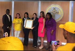 Senator Campbell presents the proclamation to the lead Volunteer Minister and executives of the Church of Scientology Miami. 