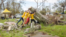 Scientology Volunteer Ministers clear fallen trees out of a Louisiana graveyard