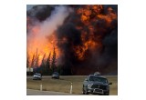 Lessons Learned - A raging wildfire consumes the forest next to Highway 63 twenty four kilometres south of Fort McMurray Saturday, May 7, 2016. The "Beast", as it was called by Wood Buffalo fire chief Darby Allen, is a 1500 square kilometre inferno that has prompted the mass evacuation of nearly 90,000 people from the northern Alberta city. (photograph by Chris Schwarz/Government of Alberta)