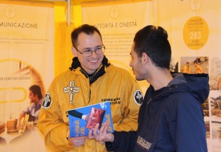 Volunteer Ministers of Modena, Italy, set up their tent to bring practical solutions for life's challenges to the community.