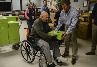 Andersen Windows & Doors Employee Delivering a Cheeriodical to a Veteran