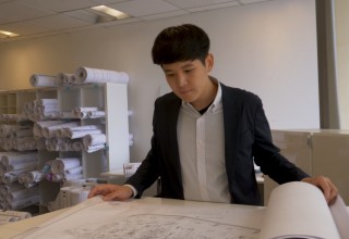 Daniel Choi reviews plans prior to a submittal