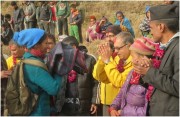 Volunteer Ministers (in yellow) present winter clothing and warm blankets to villagers in Aaru Pokhari, where nearly every one of the 240 households and the village schools suffered severe earthquake damage in the April 2015 earthquake.