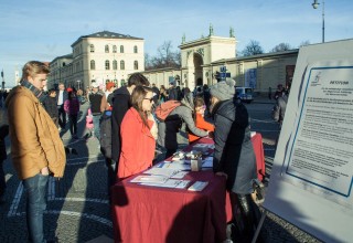 Visitors to the Youth for Human Rights booth in Munich, Germany, were welcome to take copies of the What are Human Rights? booklet to learn the 30 articles of the Universal Declaration of Human Rights and help educate others in these basic principles.