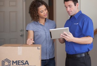 Mesa Moving Representative with Checklist and Woman Homeowner
