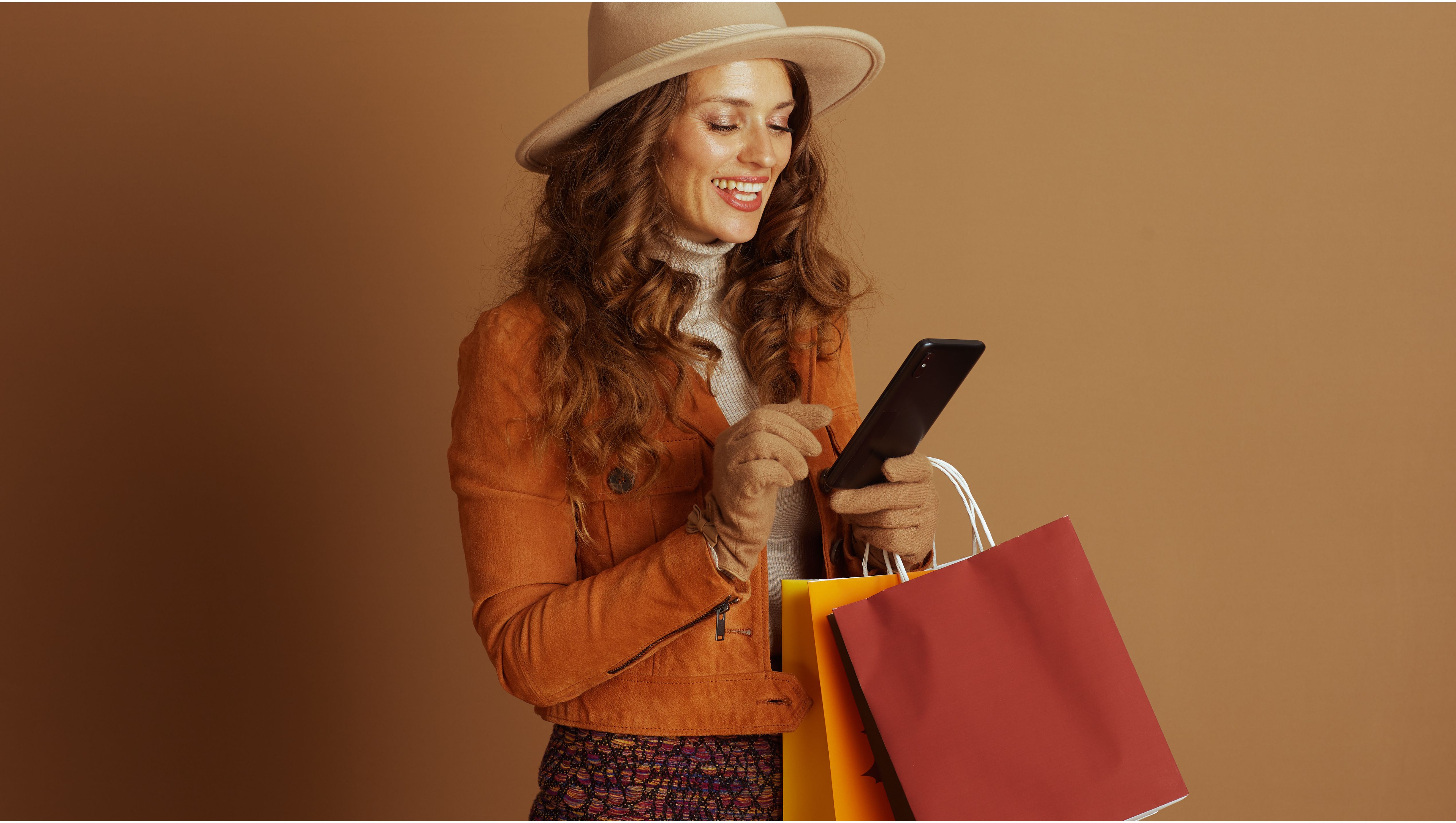 Woman checking smartphone while shopping