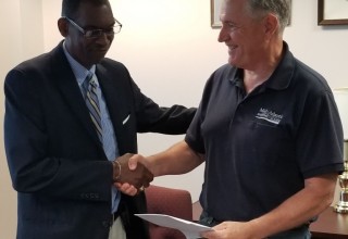 Mr. Jeffery Jones explaining to Capt. Edward Nanartowich the Courses being offered by The American School for International Business which will complement the courses being offered by MAMA.