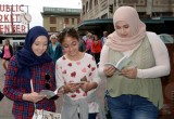 Volunteers handed out copies of The Way to Happiness on International Day of Friendship created by the U.N. to "inspire peace efforts and build bridges between communities."