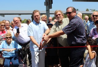 Cutting the ribbon at the solar ceremony