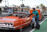 Handing a Truth About Drugs booklet to fans in a vintage Chevy convertible tricked out with the Broncos' team colors