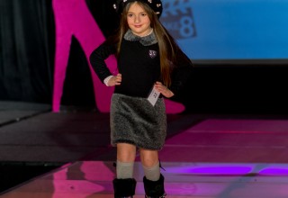 East Coast Starz Model walking the runway in a Polish inspired outfit. 