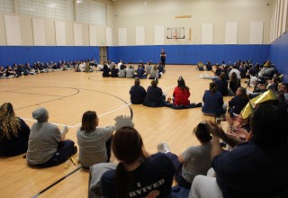 Comedian Muffy performs for inmates.