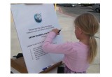 Youngster takes her first step toward a drug-free life by signing the Foundation for a Drug-Free World pledge at a booth at Randsburg, California, Old West Days.