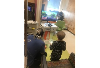 Patient at Phoenix Children's Hospital enjoying Walker Charities donation of gaming system