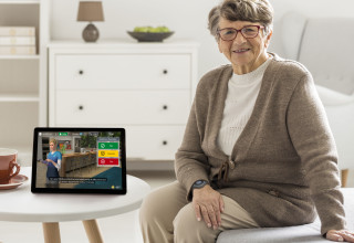 Senior Woman with Addison Care Tablet