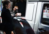 A volunteer sets up a display of The Truth About Drugs booklets on a waffle truck in Brussels