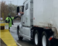 Skyway Concession Company staffer hands out free snacks for truckers