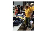 Volunteer Ministers help organize and distribute donated clothing at shelter