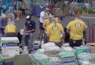 Volunteer Ministers working in a supply distribution center after the Carr Fire.