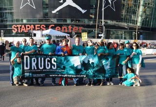 Drug-Free World volunteers at Staples Center at the NBA All-Star game, where they handed out 30,000 copies of Truth About Drugs booklets to fans.