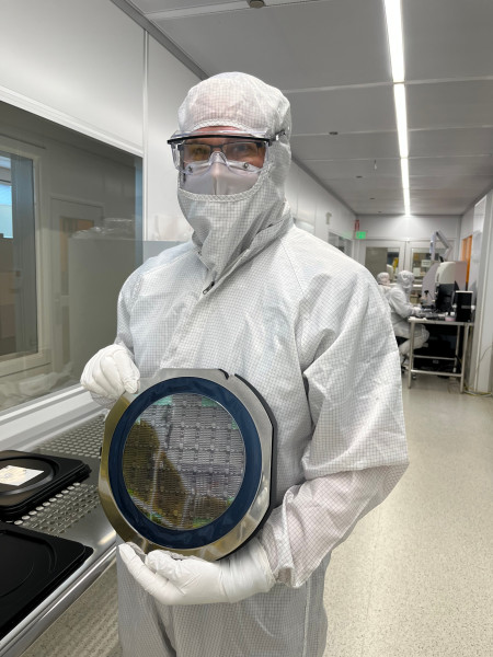 Dr. Scott Hammond with an NLM Photonics wafer