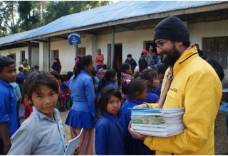 Volunteer Ministers presented notebooks to every school-aged child in the village of Aaru Pokhari.
