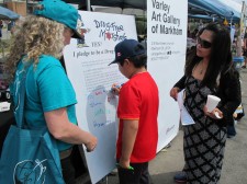 Youth sign the drug-free pledge at annual Taste of Asia Festival