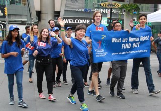 Volunteers from the Toronto chapter of Youth for Human Rights march in the 11th Youth Day Festival parade. 