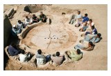 Students & Archaeologists fill the seats of the ancient Roman Bath.