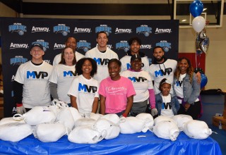 Orlando Magic Players and Their Families Join Amway Corporation Distributing Thanksgiving Meals to the Community