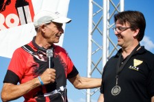 Ultramarathoner John Radich presents pedal to Damien Kevitt
