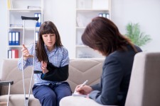 Injured Woman Speaking with Her Advocate