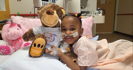 Pediatric Patient all Smiles with enCourage Kids Bear