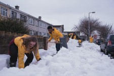 Volunteers from the Scientology Community Centre help the community dig out from the snowstorm